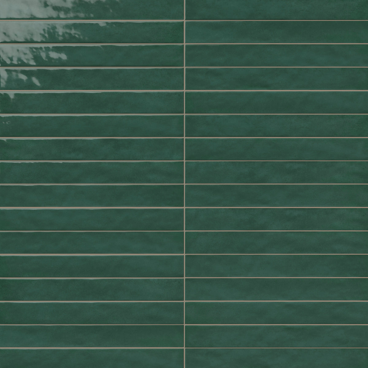 Glossy green rectangular ceramic tiles with subtle tonal variation, smooth edges, and narrow grout lines in a stacked wall pattern.