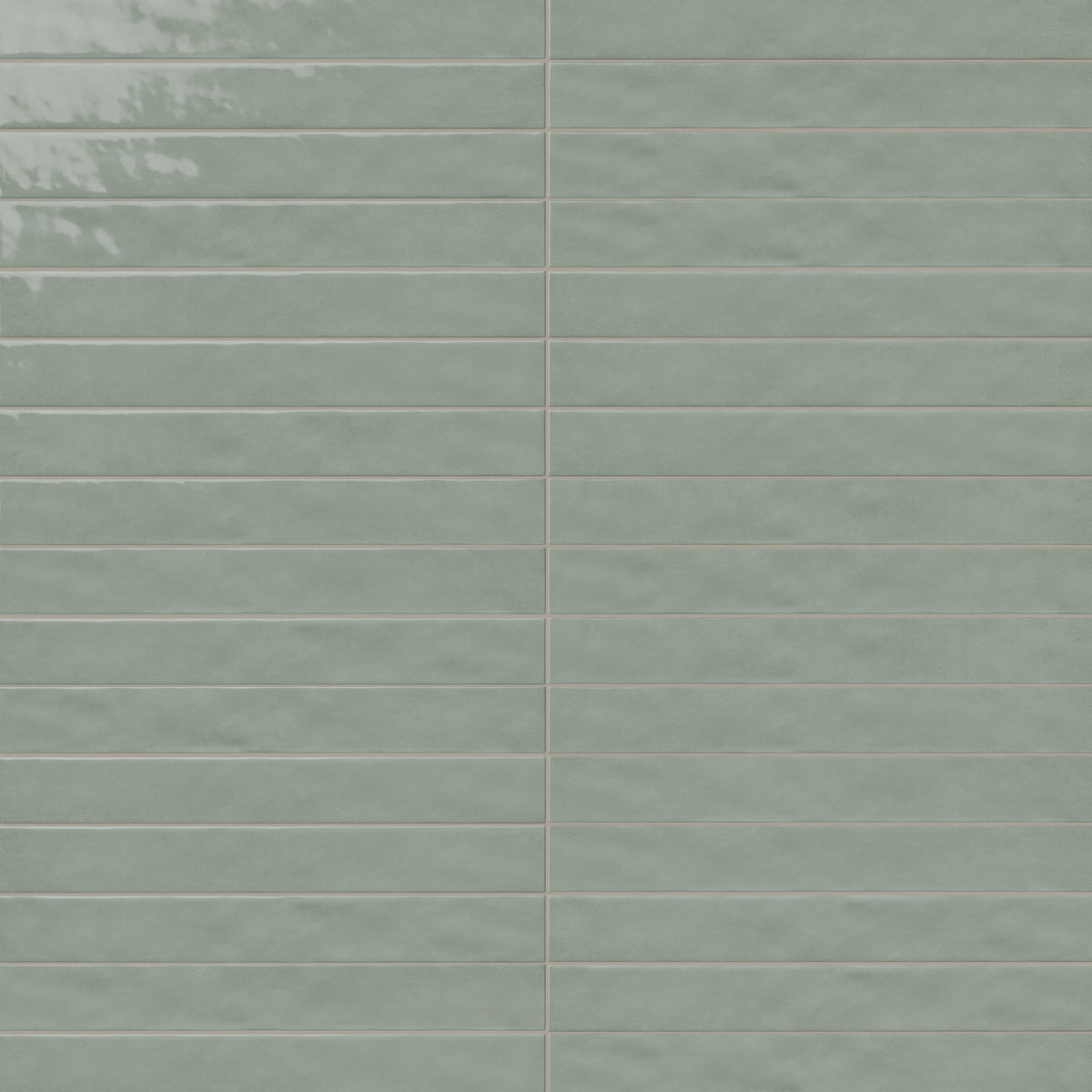 Glossy pale green rectangular ceramic tiles with subtle tonal variation, smooth edges, and narrow grout lines in a stacked wall pattern.