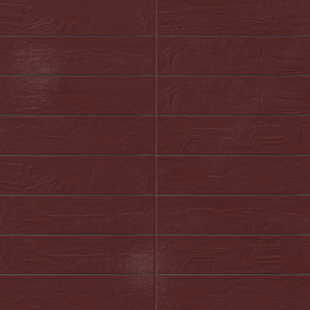 Earthy red 6x24 glossy porcelain tiles showcase subtle surface texture and layered color movement, bringing warmth and depth to the linear layout.