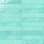 Glossy turquoise 2x13 ceramic wall tiles with a handcrafted look, gentle color variation, and a luminous glazed finish that highlights the elongated format.