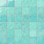 Grid of turquoise ceramic wall tiles showcasing layered color movement, a lustrous glazed finish, and subtle artisanal character across each 4x4 tile.