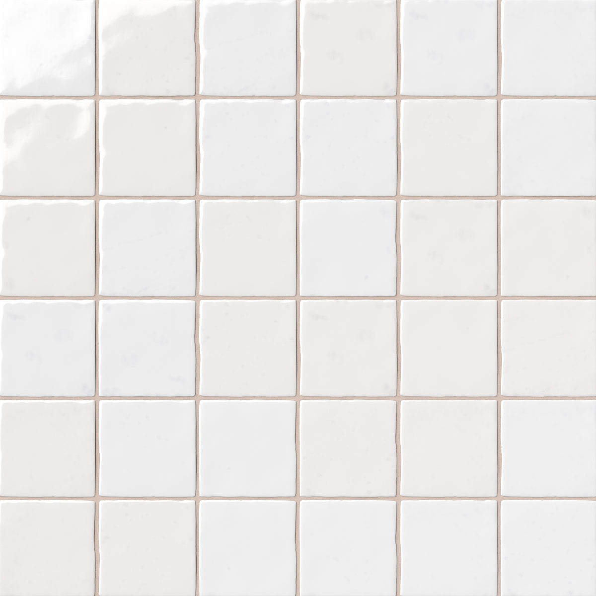White 4x4 ceramic wall tiles arranged in a square grid, featuring subtle tonal variation, softly irregular edges, and a handcrafted glazed finish.