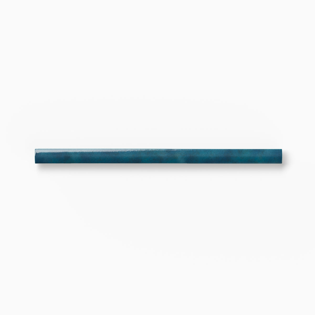 Blue ceramic rounded edge trim with rich tonal variation, organic shading, and a smooth bullnose profile displayed against a white background.