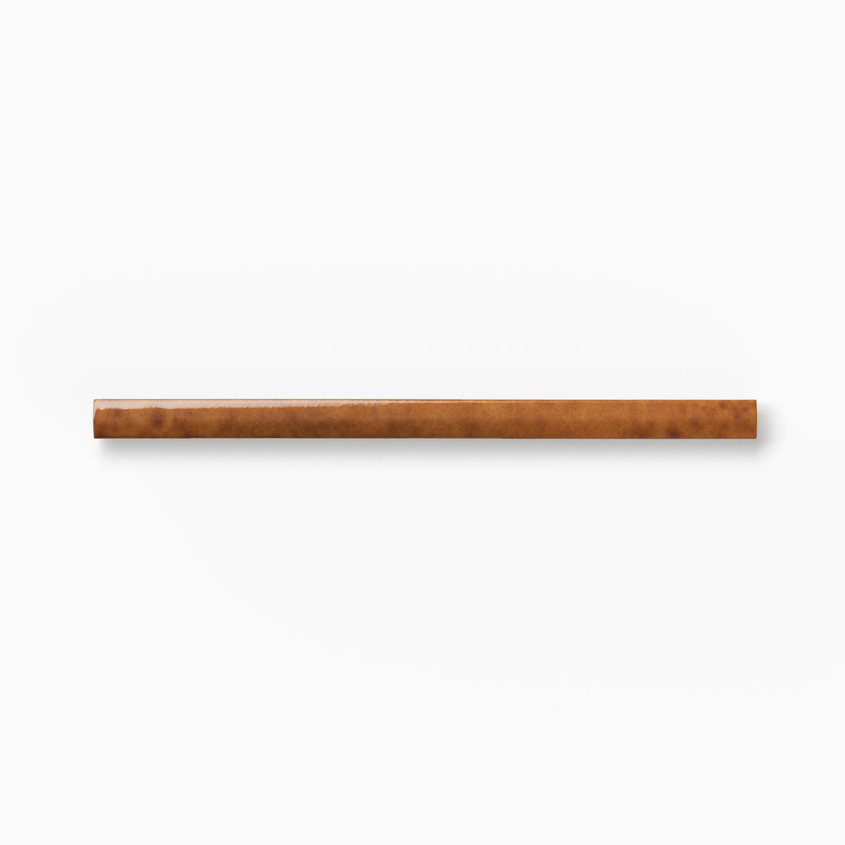 Warm brown ceramic rounded edge trim with mottled tonal variation, a handcrafted appearance, and a smooth bullnose profile against a white background.