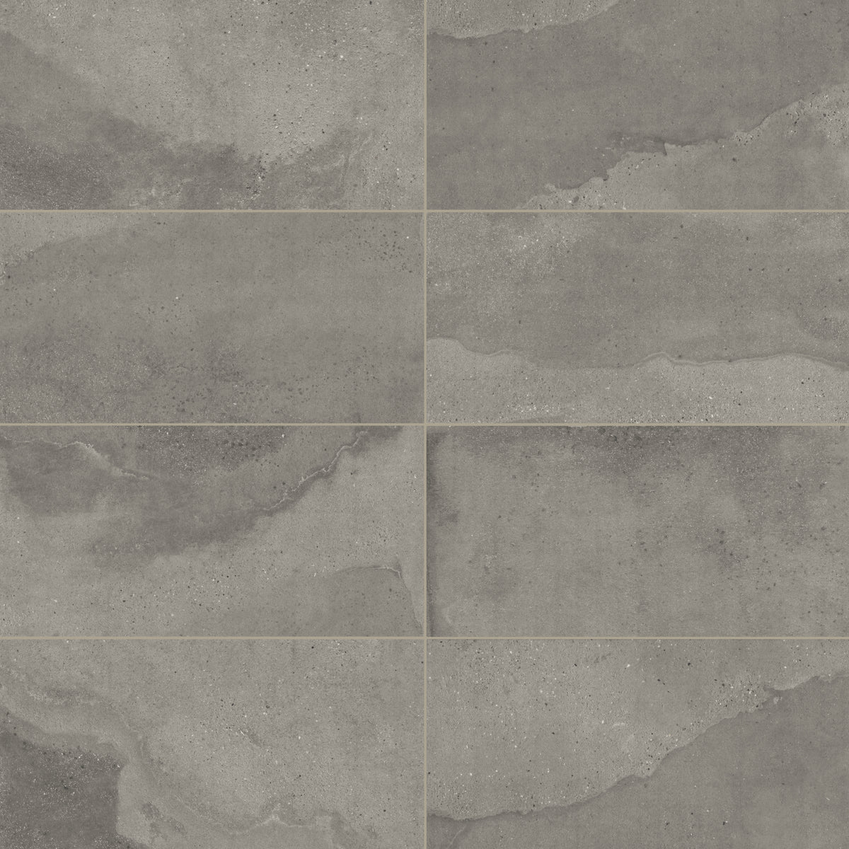 Dark gray matte porcelain tile in a classic rectangular format, featuring visual mineral flecks inspired by the shifting texture of Italian Riviera sand.