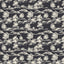 Dark gray abstract contour wallpaper with white topographic lines behind a modern ribbed wood console table.