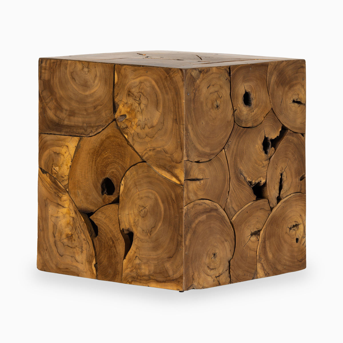 A compact cube form covered in a rich mosaic of round teak root slices in warm brown and amber tones defines our Cielo Outdoor End Table on a white background.