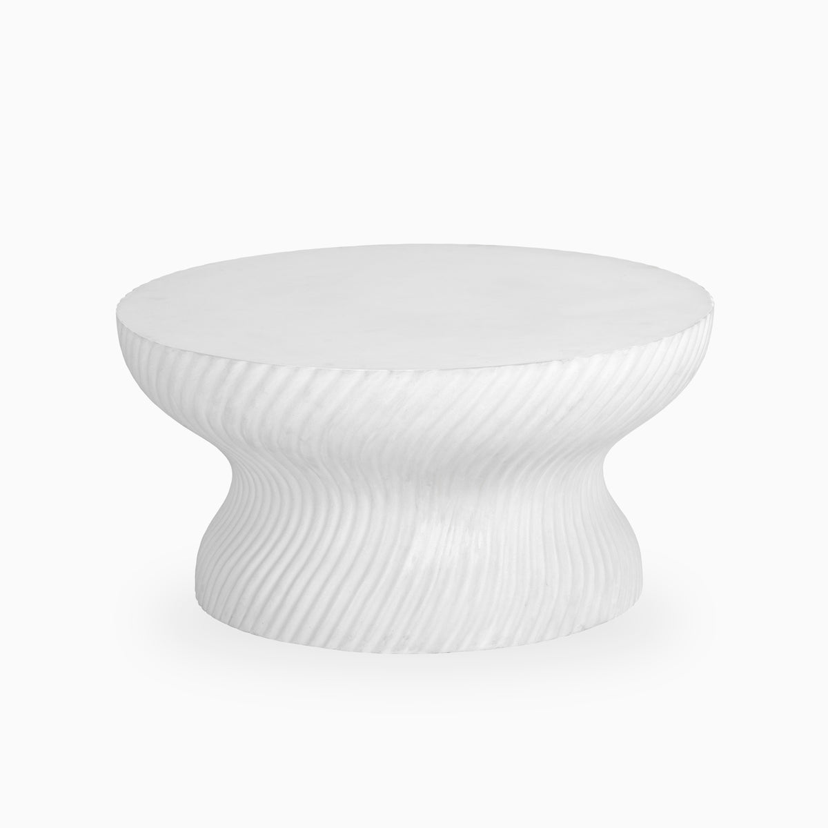 White round coffee table with a smooth circular top, hourglass pedestal base, subtle marble-like veining, and sculpted diagonal ribbed texture in a matte stone finish.