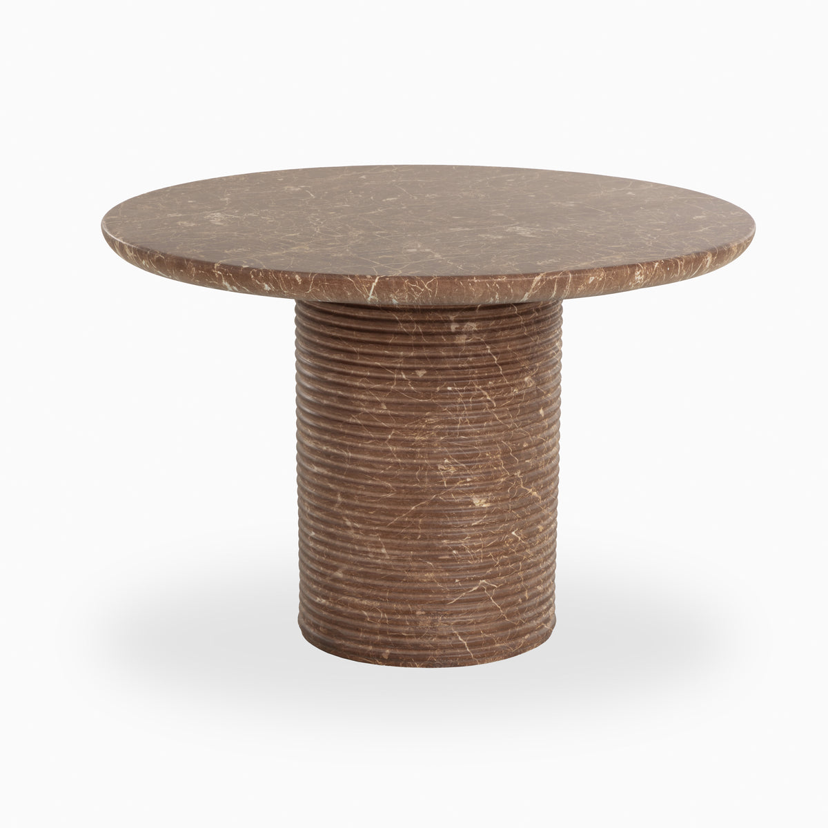 Round brown outdoor dining table with an eased-edge top, ribbed cylindrical pedestal base, and marble-inspired beige veining with fine crackle details across the concrete surface.