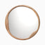 Round wall mirror with an organically shaped solid wood frame in a warm natural finish, featuring subtle curves that add sculptural character to a modern interior.