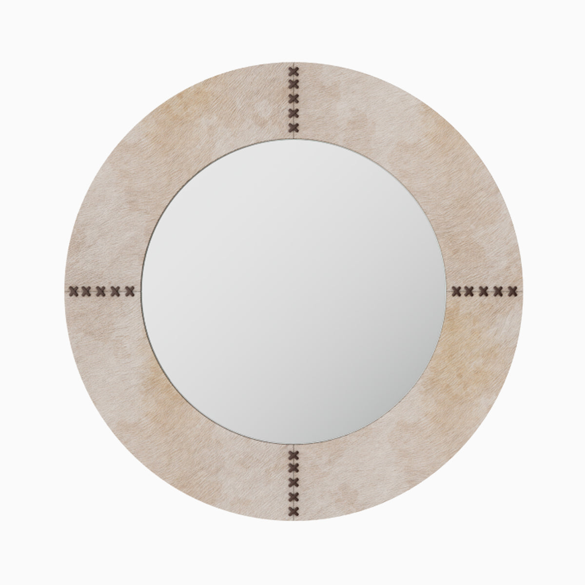 Round mirror wrapped in white hair-on cowhide with organic tonal variation and brown leather whip-stitch accents inspired by saddlework.