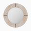 Round mirror wrapped in white hair-on cowhide with organic tonal variation and brown leather whip-stitch accents inspired by saddlework.