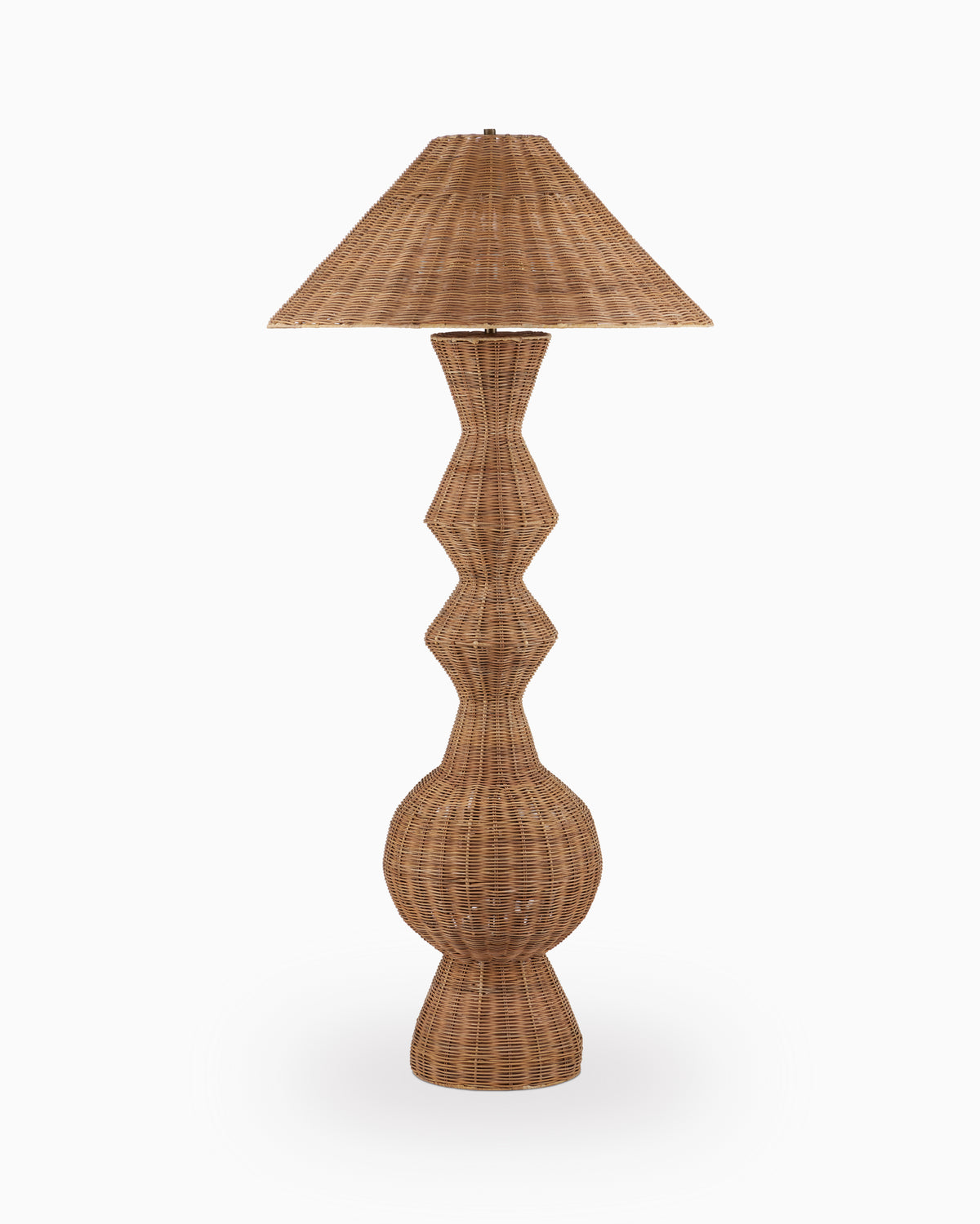 Woven rattan floor lamp with a wide tapered shade and sculptural hourglass base on a plain white background.