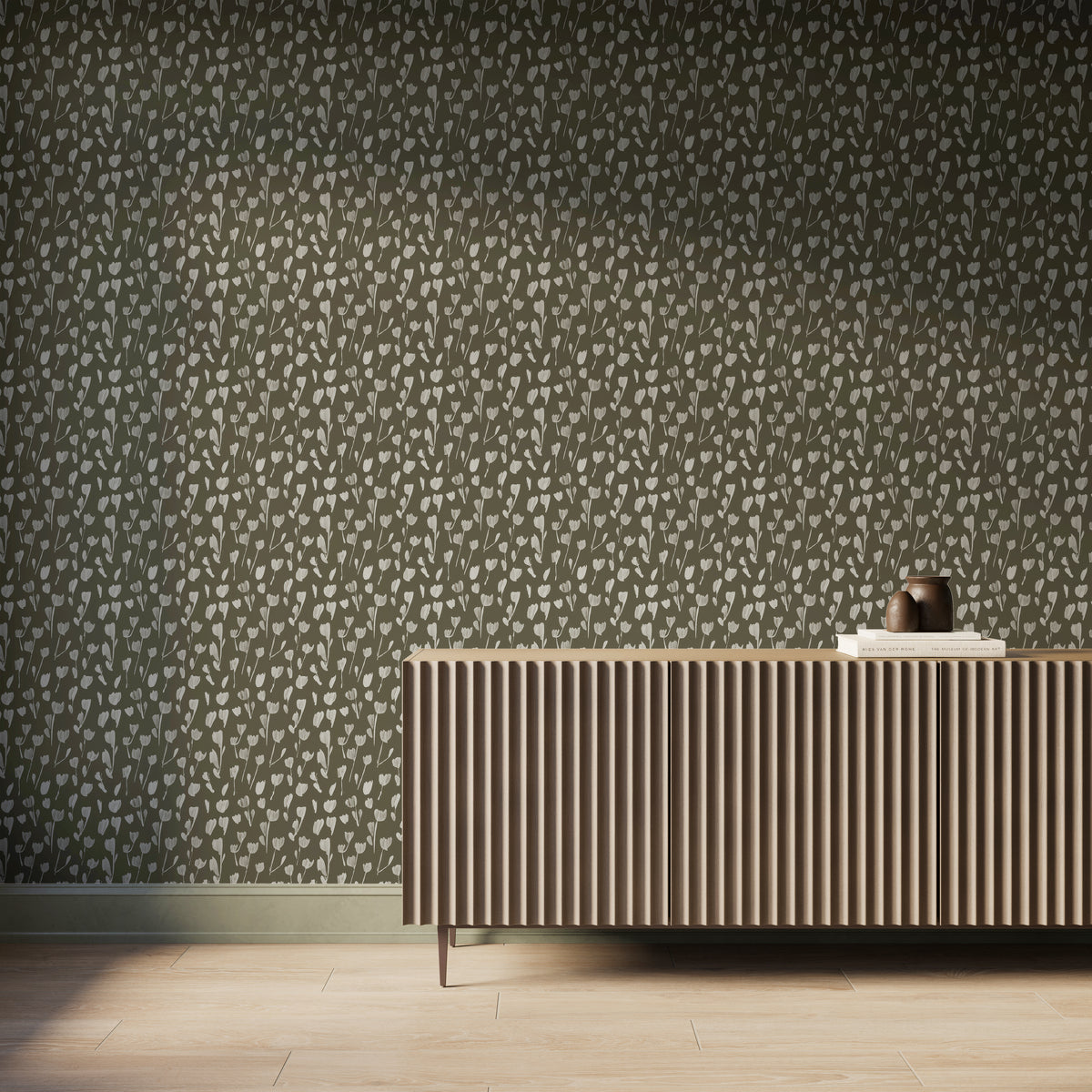 Petaline wallpaper Olive II creates an earthy backdrop with off-white floral silhouettes over olive green behind a fluted wood console, fitting organic interiors.